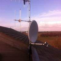 Satellite dish on roof of a house in West Sussex